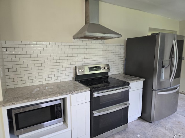 213 April Dr, Old Hickory, TN 37138 - kitchen with appliances with stainless steel finishes, wall chimney range hood, white cabinets, tasteful backsplash, and light stone countertops