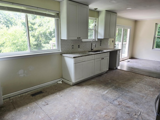 213 April Dr, Old Hickory, TN 37138 - kitchen featuring backsplash, light stone counters, dishwashing machine, and crown molding