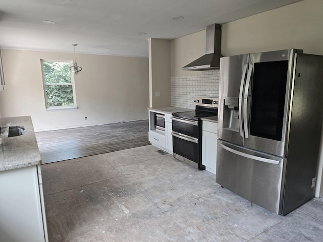 213 April Dr, Old Hickory, TN 37138 - kitchen featuring appliances with stainless steel finishes, wall chimney range hood, backsplash, white cabinets, and decorative light fixtures