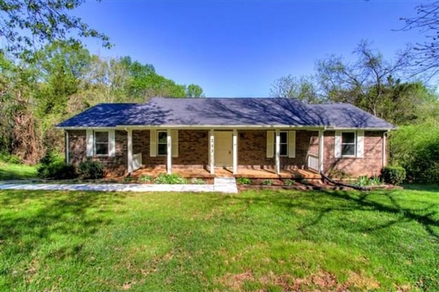 213 April Dr, Old Hickory, TN 37138 - single story home with covered porch, a front lawn, and brick siding