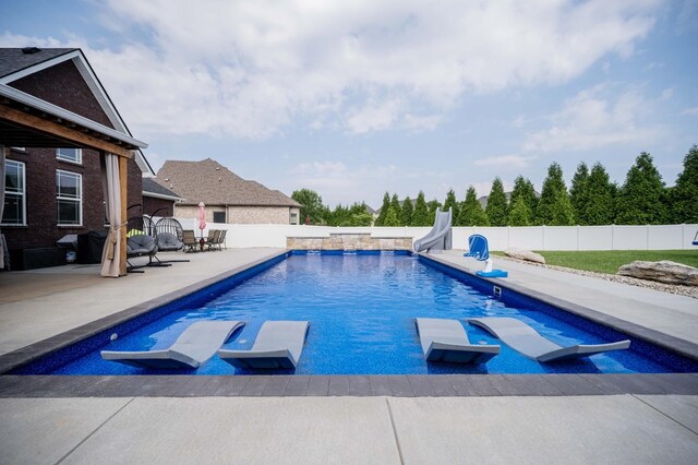 2331 Lionheart Dr, Murfreesboro, TN 37130 - view of pool with a water slide, a patio, and a fenced backyard