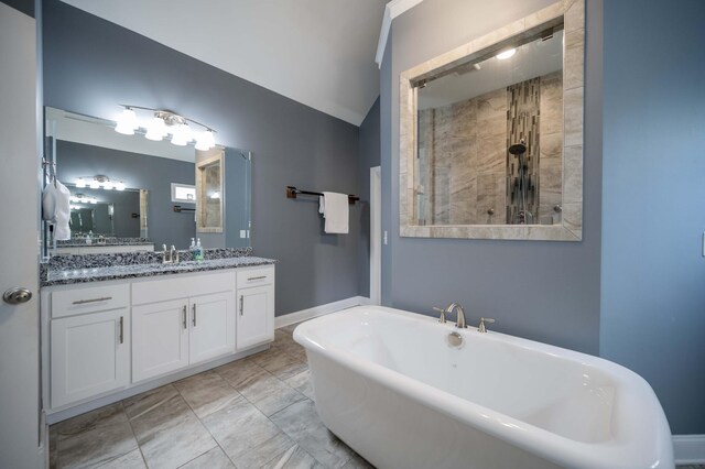 2331 Lionheart Dr, Murfreesboro, TN 37130 - bathroom with a freestanding tub, tiled shower, vanity, and lofted ceiling
