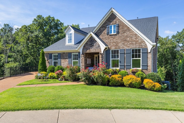 7156 Triple Crown Ln, Fairview, TN 37062 - view of front of house with stone siding, roof with shingles, and brick siding
