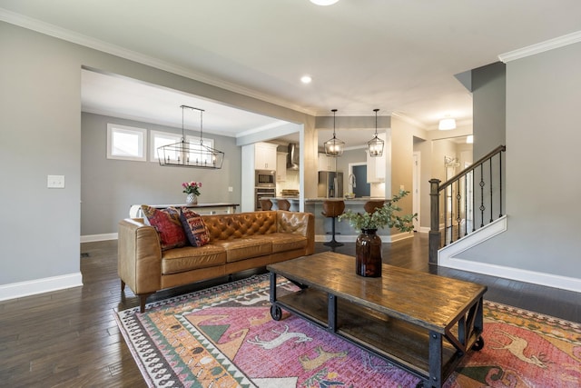 7156 Triple Crown Ln, Fairview, TN 37062 - living room featuring dark wood-style floors, ornamental molding, stairs, recessed lighting, and a chandelier