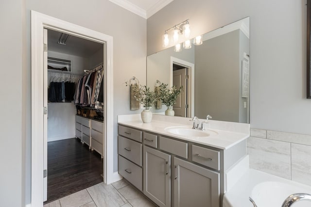 7156 Triple Crown Ln, Fairview, TN 37062 - bathroom with ornamental molding, vanity, a spacious closet, and a bath