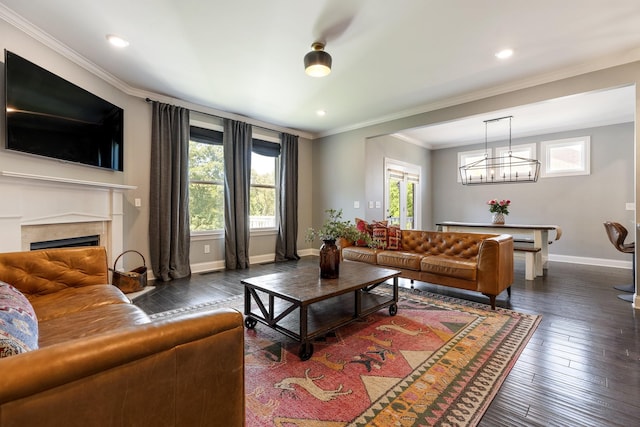 7156 Triple Crown Ln, Fairview, TN 37062 - living room with dark wood finished floors, ornamental molding, a fireplace, a chandelier, and recessed lighting
