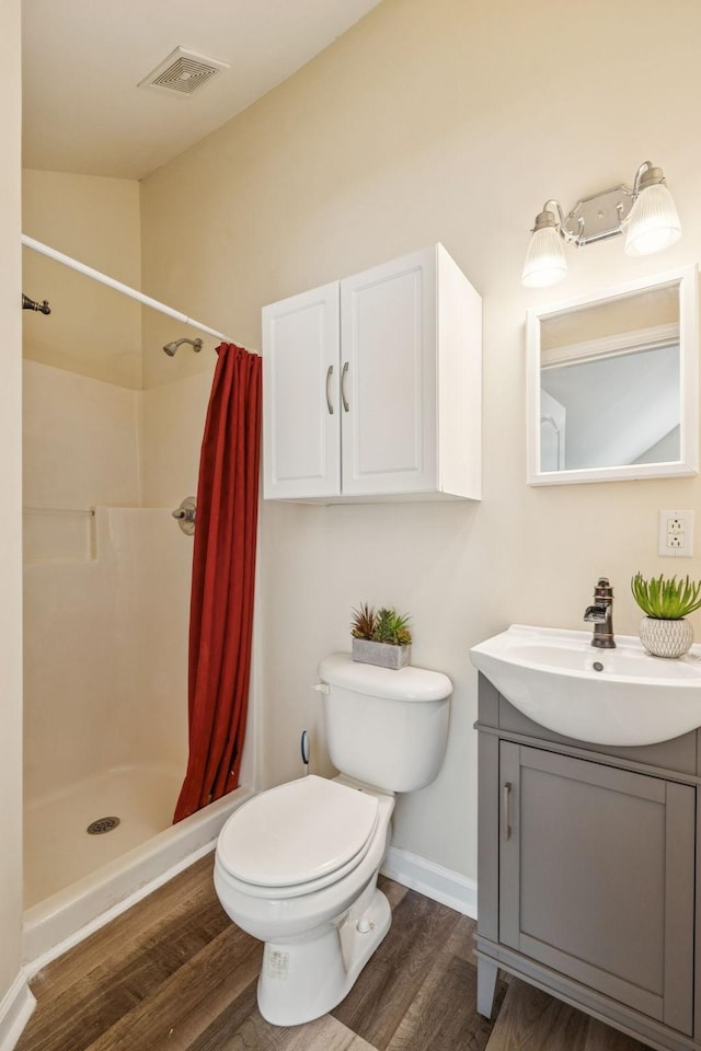2414 Keegan Dr, Murfreesboro, TN 37130 - full bath with vanity, wood finished floors, and a shower with curtain