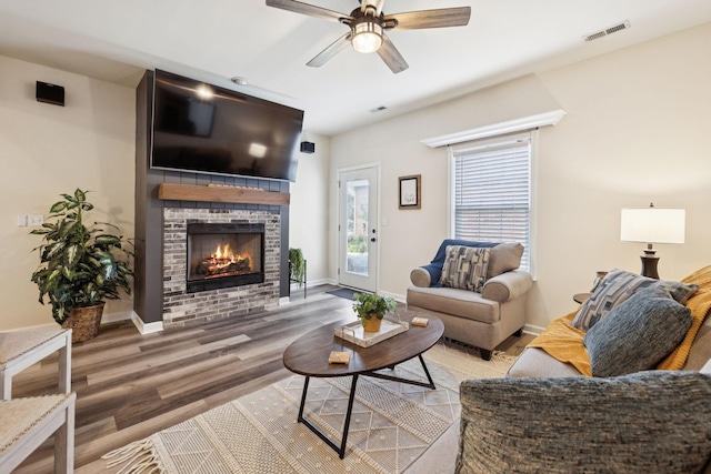 2414 Keegan Dr, Murfreesboro, TN 37130 - living area with ceiling fan, wood finished floors, and a fireplace