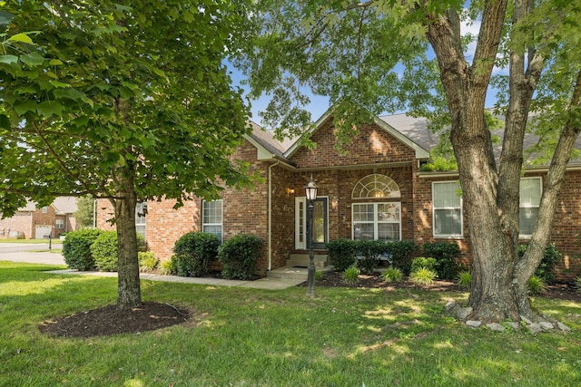 2414 Keegan Dr, Murfreesboro, TN 37130 - view of front facade featuring a front yard and brick siding
