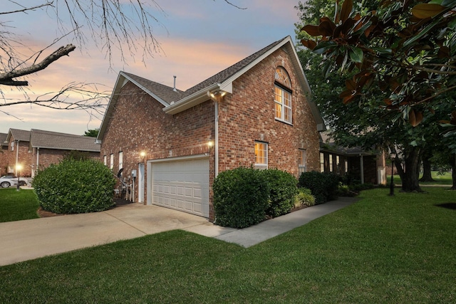2414 Keegan Dr, Murfreesboro, TN 37130 - view of side of property featuring brick siding, concrete driveway, a yard, and a shingled roof