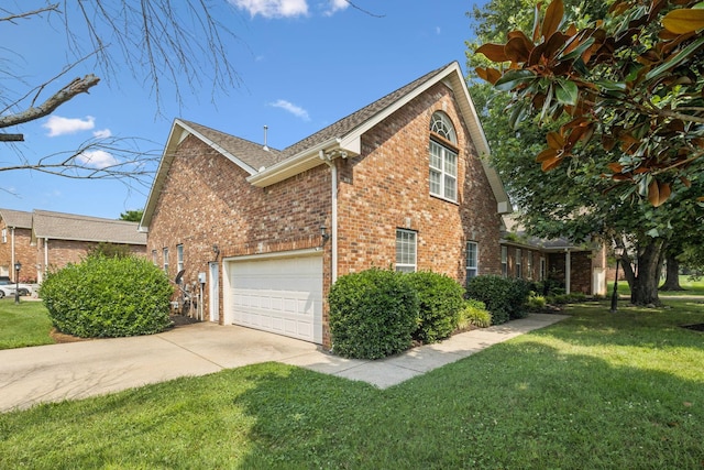 2414 Keegan Dr, Murfreesboro, TN 37130 - view of home's exterior featuring brick siding, a lawn, driveway, roof with shingles, and a garage