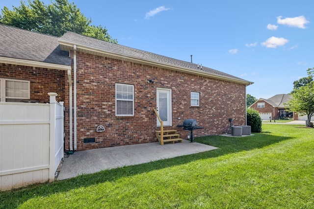 2414 Keegan Dr, Murfreesboro, TN 37130 - rear view of house with entry steps, a patio, brick siding, and roof with shingles