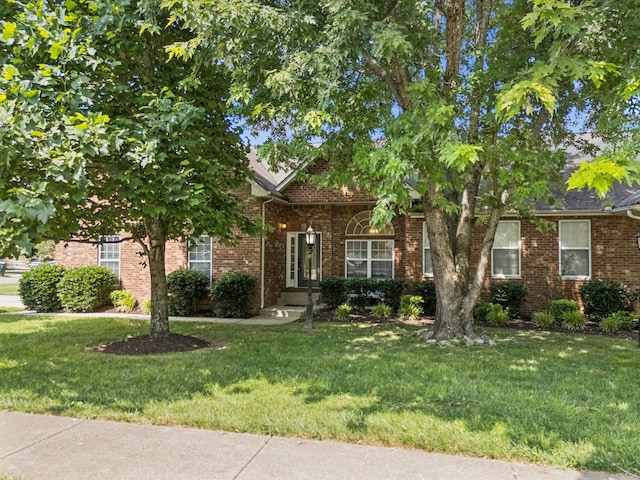 2414 Keegan Dr, Murfreesboro, TN 37130 - obstructed view of property with a front lawn and brick siding