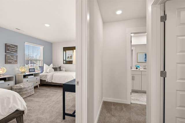 1243 Tucker Dr, Lebanon, TN 37087 - bedroom with light carpet, ensuite bath, and recessed lighting