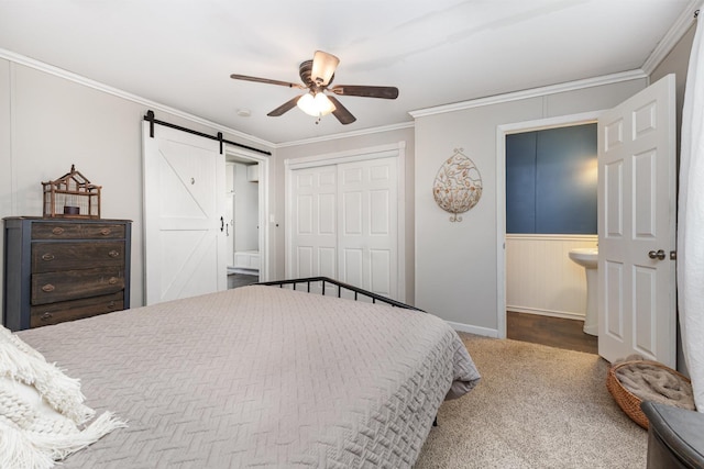 5519 Noble King Rd, Franklin, TN 37064 - bedroom featuring a barn door, crown molding, a closet, a ceiling fan, and carpet