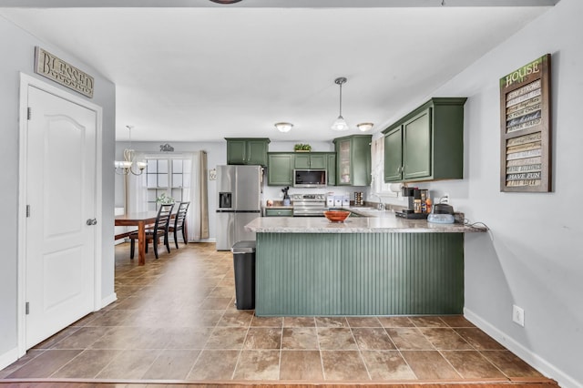1338 Loren Cir, Clarksville, TN 37042 - kitchen featuring green cabinetry, appliances with stainless steel finishes, a peninsula, and pendant lighting