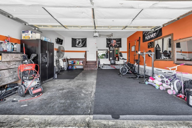 1338 Loren Cir, Clarksville, TN 37042 - garage with black refrigerator with ice dispenser