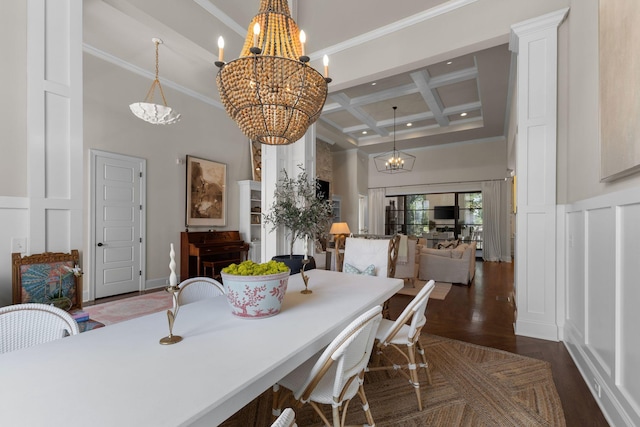 7318 Harlow Dr, College Grove, TN 37046 - dining room featuring a towering ceiling, coffered ceiling, a chandelier, beamed ceiling, and a decorative wall