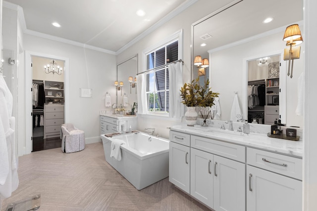 7318 Harlow Dr, College Grove, TN 37046 - full bathroom featuring two vanities, a chandelier, a walk in closet, a tub to relax in, and crown molding