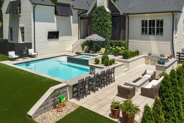 7318 Harlow Dr, College Grove, TN 37046 - view of swimming pool with a patio, exterior kitchen, a pool with connected hot tub, and an outdoor bar