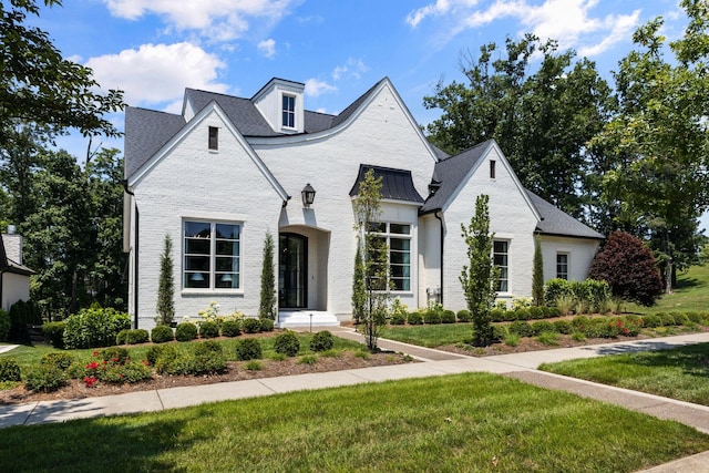 7318 Harlow Dr, College Grove, TN 37046 - french country style house featuring brick siding and a front yard