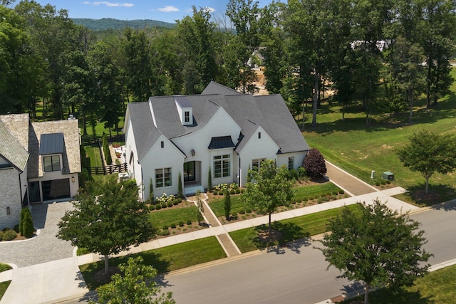 7318 Harlow Dr, College Grove, TN 37046 - view of front of property featuring a standing seam roof, stucco siding, and a metal roof
