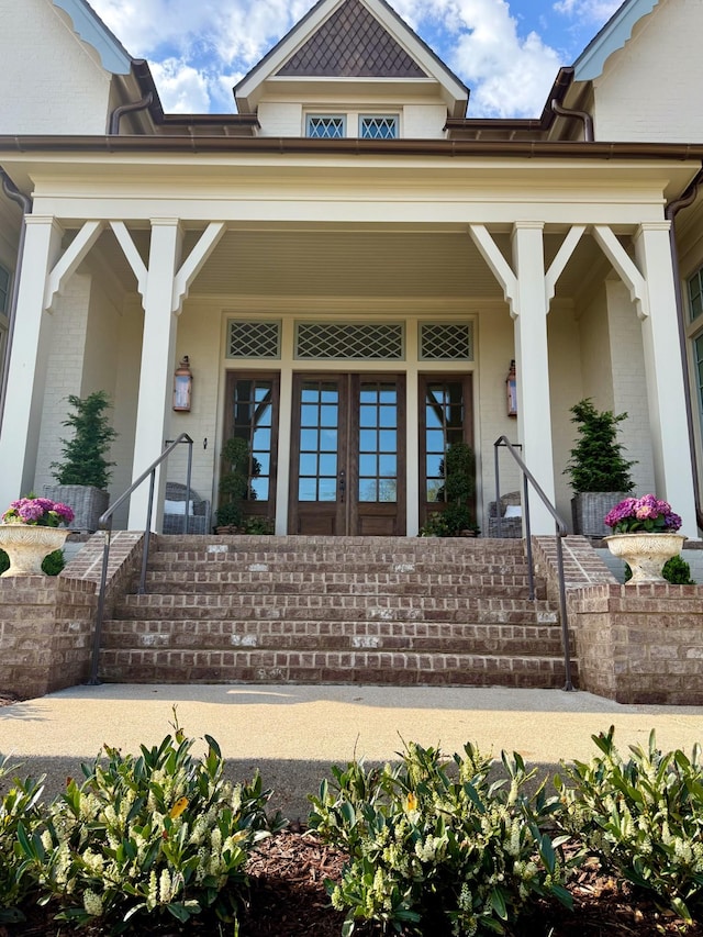 391 The Lady Of The Lake Ln, Franklin, TN 37067 - view of exterior entry featuring covered porch and brick siding