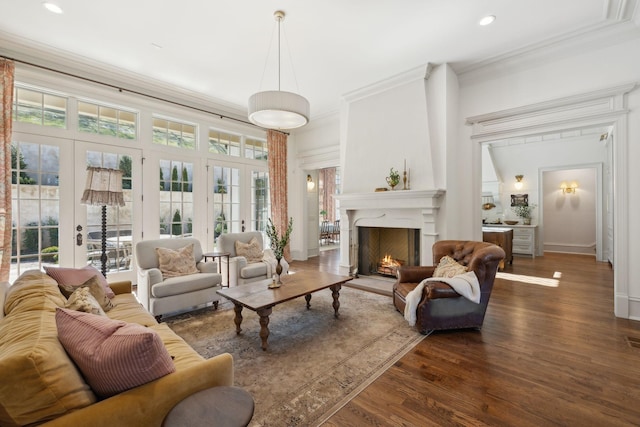 391 The Lady Of The Lake Ln, Franklin, TN 37067 - living area with crown molding, dark wood-style floors, a warm lit fireplace, recessed lighting, and french doors