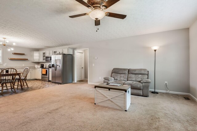 183 Caydras Way, Lafayette, TN 37083 - living room featuring light carpet, a ceiling fan, and a textured ceiling
