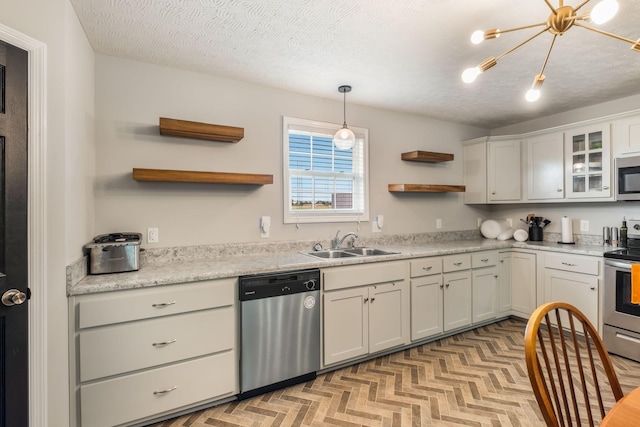 183 Caydras Way, Lafayette, TN 37083 - kitchen featuring appliances with stainless steel finishes, open shelves, light countertops, pendant lighting, and a textured ceiling