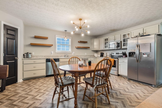 183 Caydras Way, Lafayette, TN 37083 - dining space featuring a chandelier and a textured ceiling