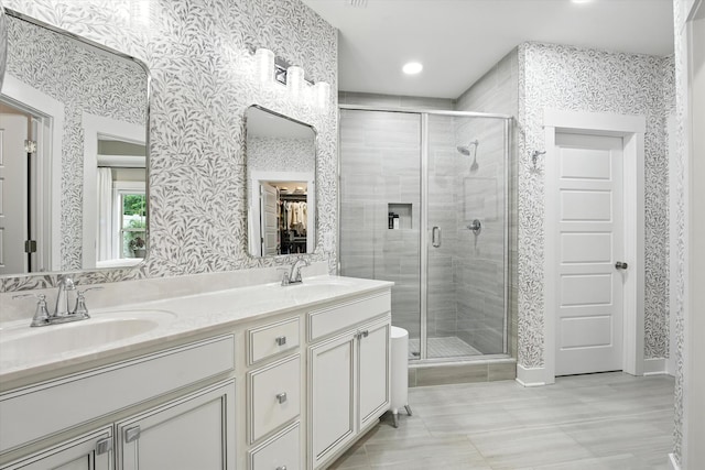 2135 Halfmoon Way, Murfreesboro, TN 37130 - bathroom with wallpapered walls, a shower stall, double vanity, tile patterned floors, and recessed lighting
