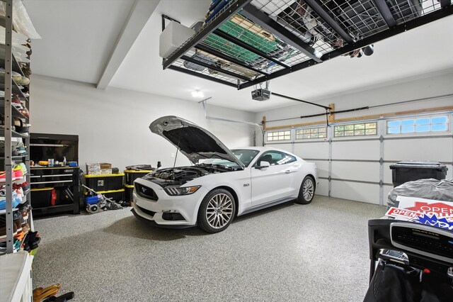 2135 Halfmoon Way, Murfreesboro, TN 37130 - garage featuring a garage door opener