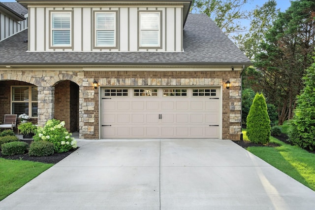 2135 Halfmoon Way, Murfreesboro, TN 37130 - view of front of home with stone siding, a shingled roof, concrete driveway, and a porch