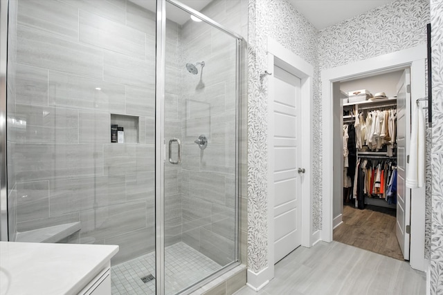 2135 Halfmoon Way, Murfreesboro, TN 37130 - full bath featuring a shower stall, vanity, a walk in closet, and wood finished floors