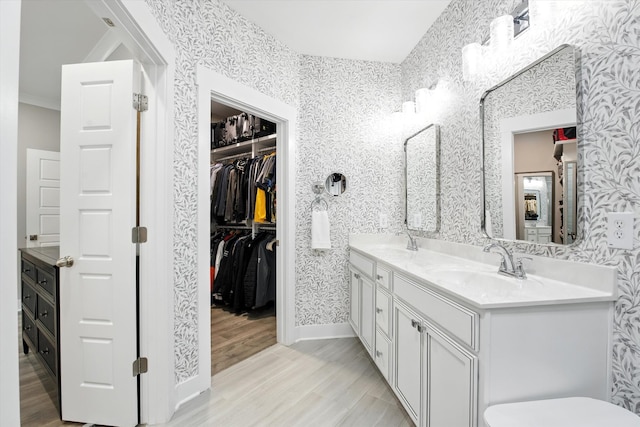 2135 Halfmoon Way, Murfreesboro, TN 37130 - full bath with wallpapered walls, double vanity, wood finished floors, and a walk in closet