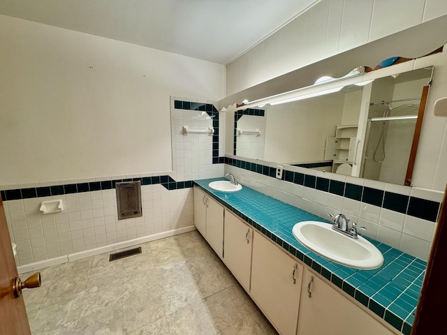 1039 Old Martha Washngton Rd, Clarkrange, TN 38553 - full bath with tile walls, double vanity, and a shower stall