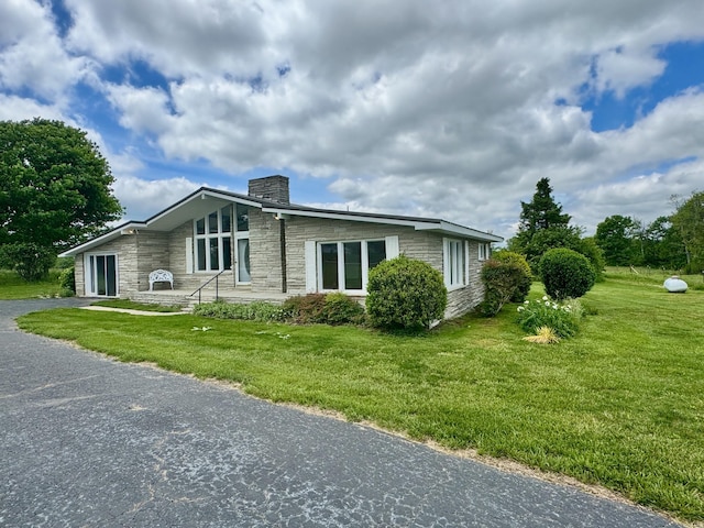 1039 Old Martha Washngton Rd, Clarkrange, TN 38553 - view of front of property featuring stone siding, a chimney, and a front lawn