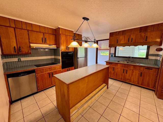 1039 Old Martha Washngton Rd, Clarkrange, TN 38553 - kitchen featuring black appliances, backsplash, under cabinet range hood, brown cabinets, and tile countertops