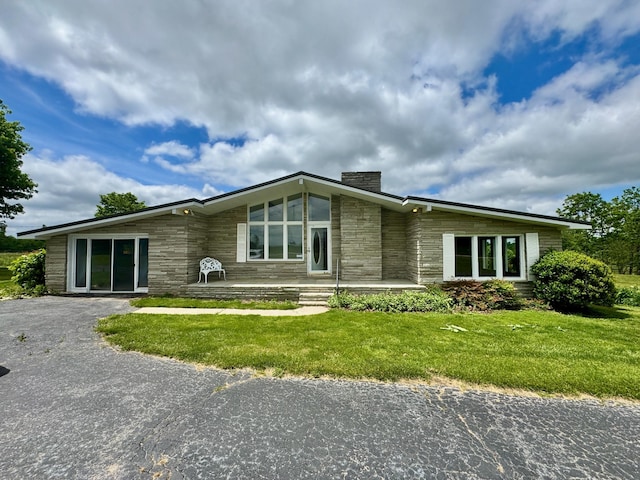 1039 Old Martha Washngton Rd, Clarkrange, TN 38553 - mid-century inspired home featuring stone siding, a chimney, and a front lawn