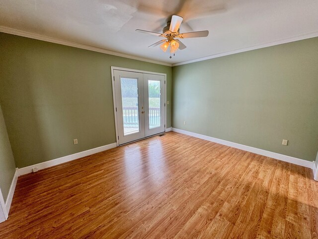 1039 Old Martha Washngton Rd, Clarkrange, TN 38553 - spare room featuring french doors, light wood-style flooring, crown molding, and ceiling fan