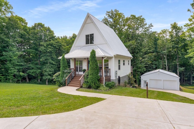 1418 Ridge Rd, Dickson, TN 37055 - view of front of house with a porch, an outdoor structure, a garage, and a front yard