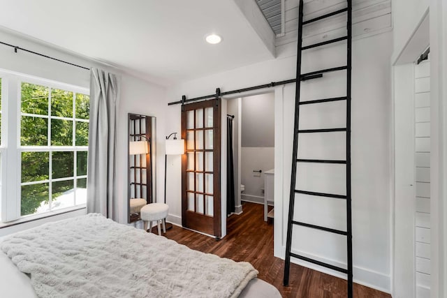 1418 Ridge Rd, Dickson, TN 37055 - bedroom with a barn door, dark wood finished floors, and recessed lighting