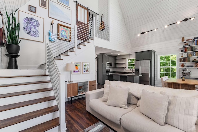 1418 Ridge Rd, Dickson, TN 37055 - living area with a towering ceiling, stairway, and dark wood-style floors