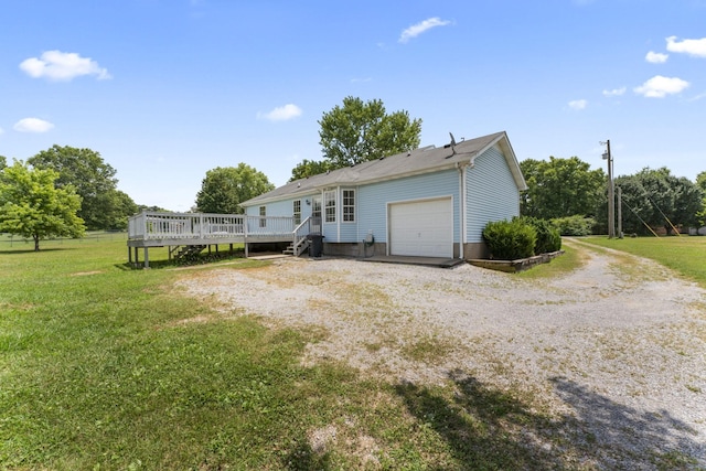 232 Elmwood Dr, Murfreesboro, TN 37128 - view of front of home featuring a wooden deck, a front lawn, driveway, and a garage