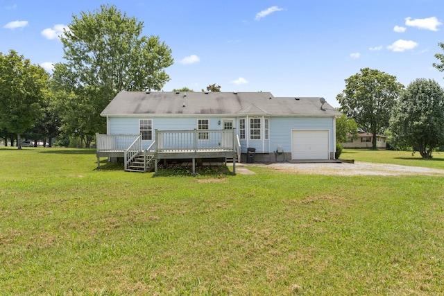232 Elmwood Dr, Murfreesboro, TN 37128 - rear view of property featuring an attached garage, driveway, a deck, and a lawn