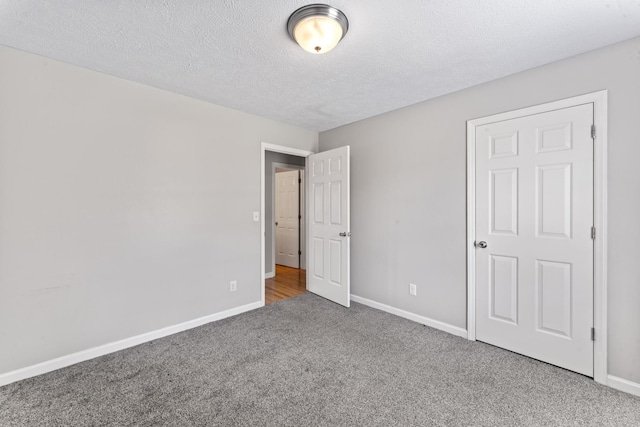 232 Elmwood Dr, Murfreesboro, TN 37128 - unfurnished bedroom featuring carpet flooring and a textured ceiling