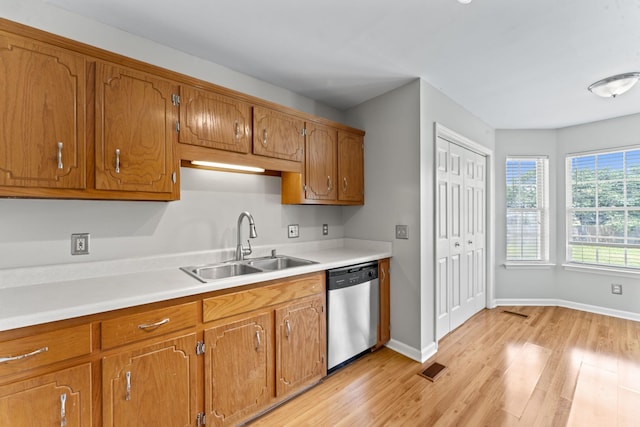 232 Elmwood Dr, Murfreesboro, TN 37128 - kitchen with dishwasher, light wood-style floors, brown cabinetry, and light countertops