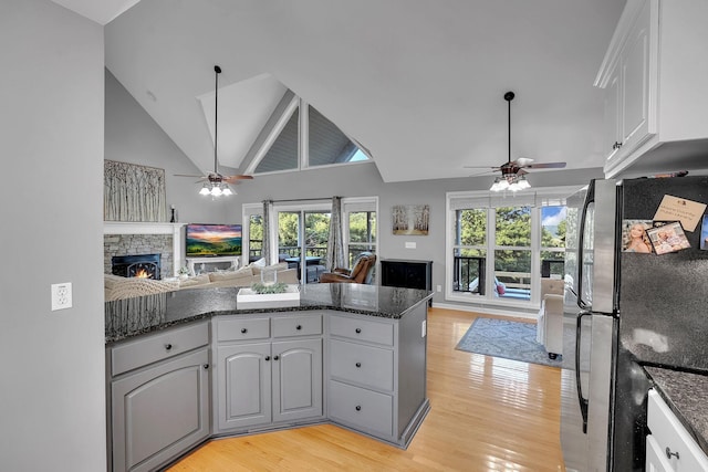268 Crest Dr, Lynchburg, TN 37352 - kitchen with ceiling fan, open floor plan, freestanding refrigerator, light wood-style floors, and high vaulted ceiling