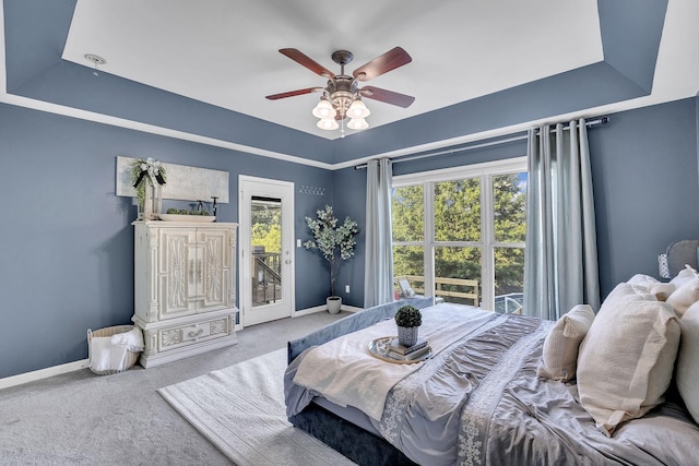 268 Crest Dr, Lynchburg, TN 37352 - carpeted bedroom featuring access to outside, a tray ceiling, and ceiling fan
